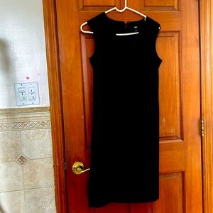 Below knee, classic cocktail dress .Very comfortable . Excellent condition.
